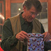 An inquisitive Tom Ducibella carefully unwraps his selection